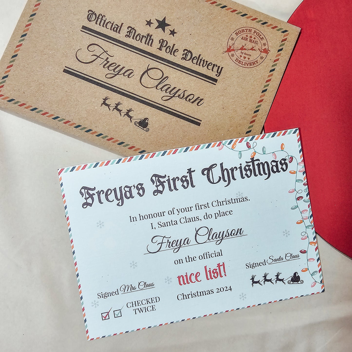 Personalised Santa Nice List certificate for a baby’s first Christmas, including a custom envelope and a sticker for sealing.