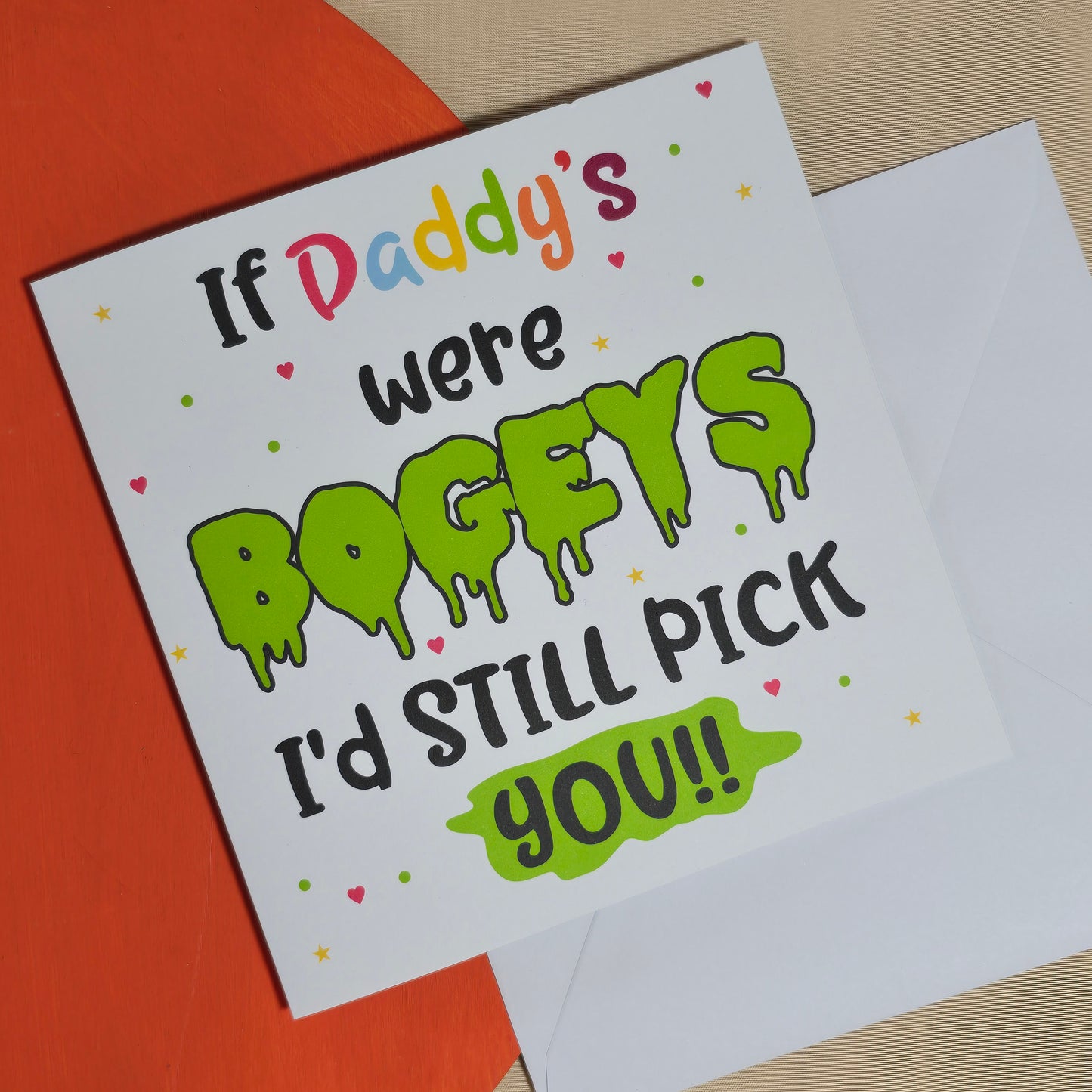 Card with humorous text 'If Daddy's were bogeys I'd still pick you!' on a colorful background