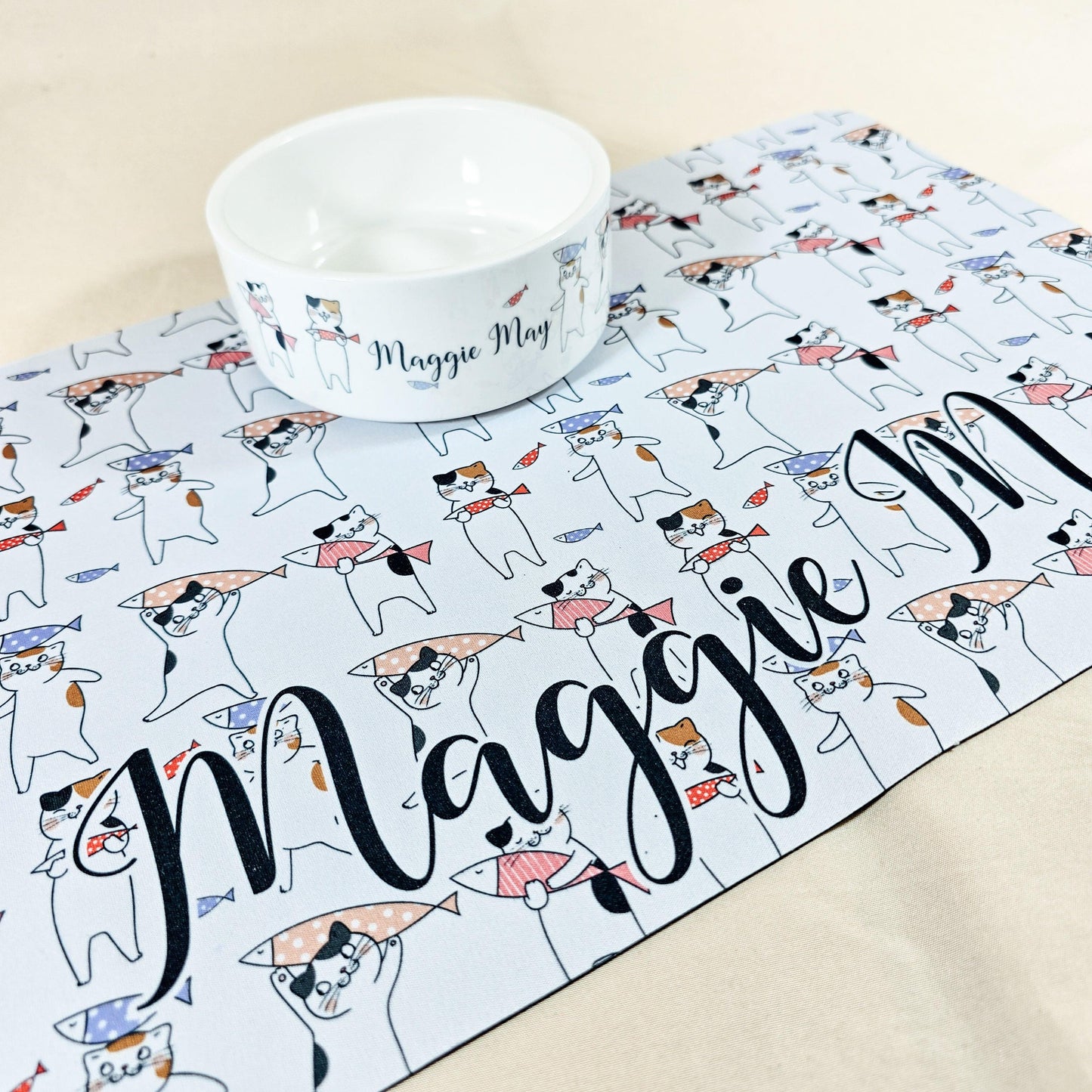 "Personalised ceramic cat bowl with custom name and cute cat drawings, available as a food or water dish. Perfect gift for cats and kittens.