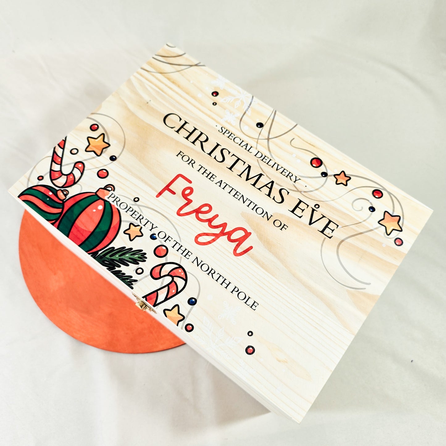 A personalised Christmas Eve box featuring a traditional design and a name, perfect for storing festive treats and gifts for children.