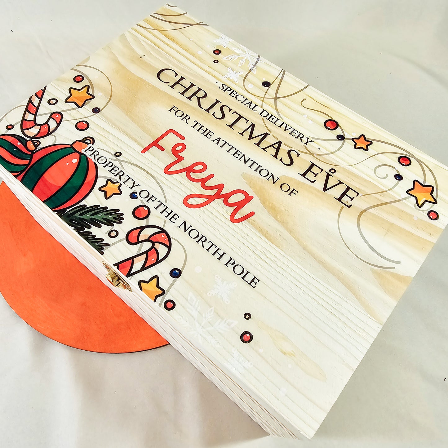 A personalised Christmas Eve box featuring a traditional design and a name, perfect for storing festive treats and gifts for children.