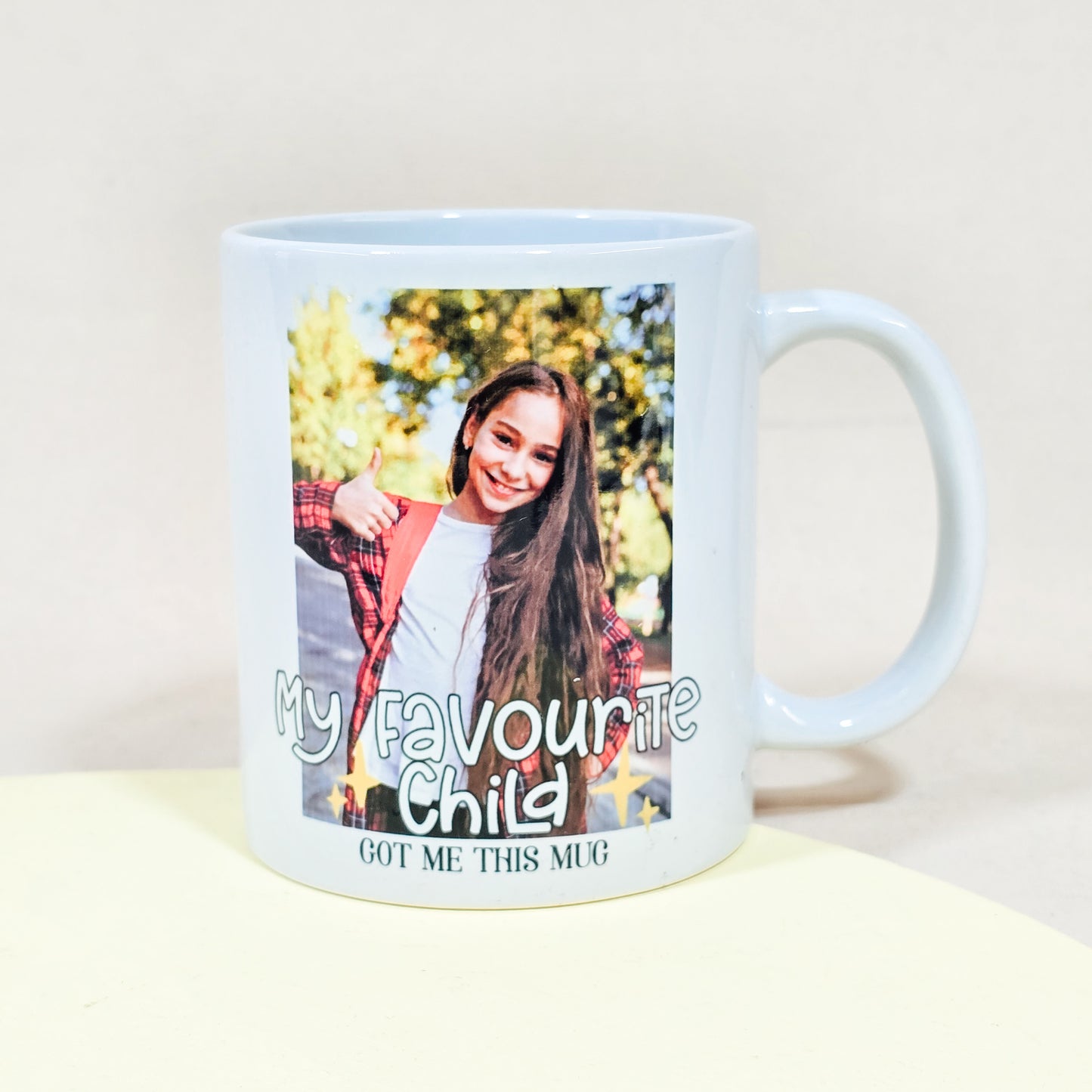 White ceramic photo mug with custom image and the text "My favourite child got me this mug."