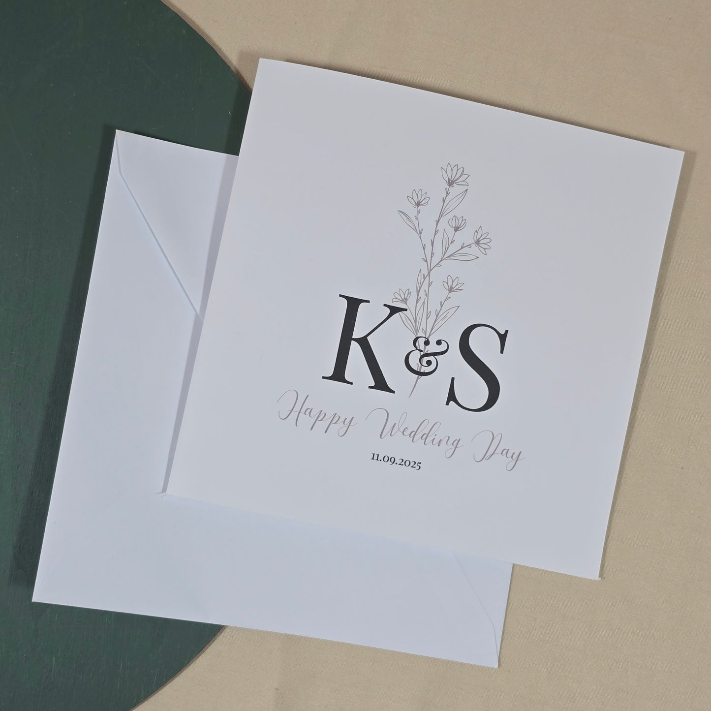 White card with 'K&S' initials and 'Happy Wedding Day' text on a beige background