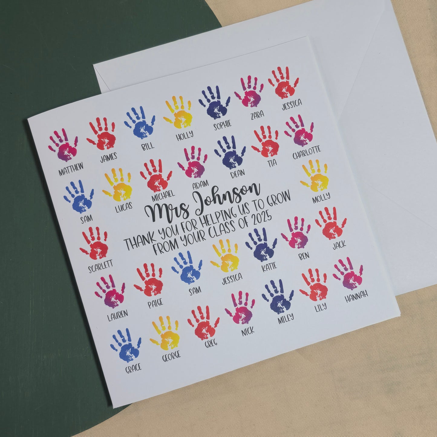 Card with colorful handprints and text on a plain background