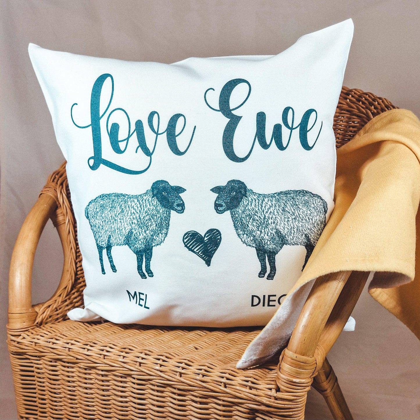 Personalised cushion cover featuring two sheep and the text 'Love Ewe' with custom couple's names, 40x40cm, romantic and farmhouse style.