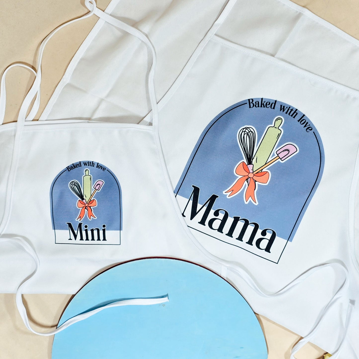 Personalised mama and mini matching aprons with text customisation options for baking. Available in toddler or child size.