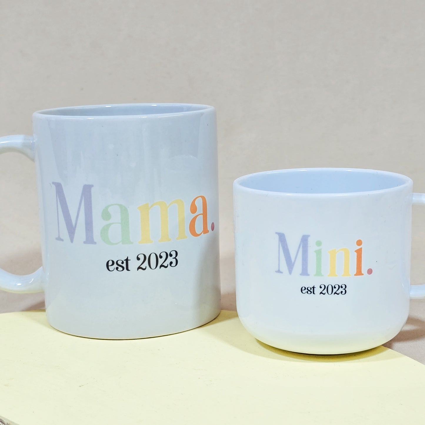 Matching Mama and Mini pastel mugs with personalised names and year, ceramic and polymer set