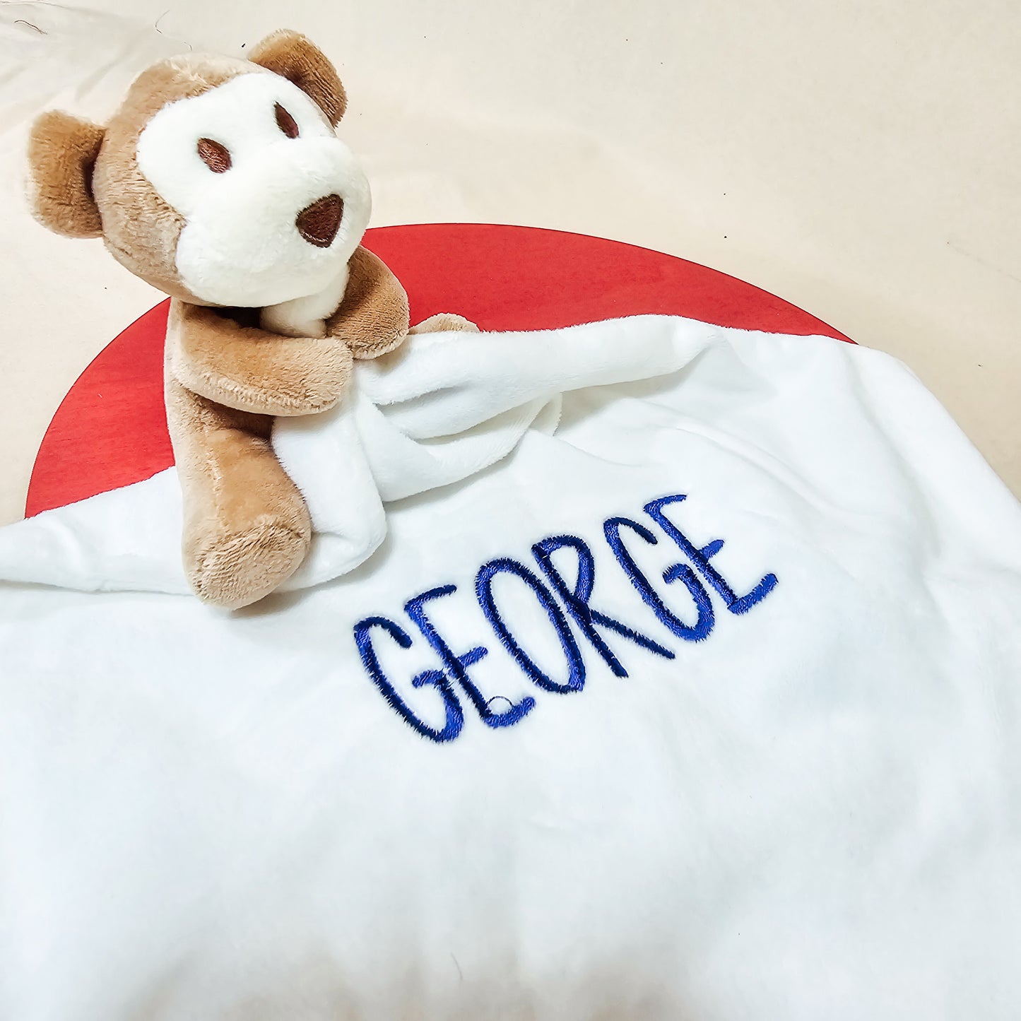 A soft and cuddly monkey comforter embroidered with a childβs name, available in purple, blue, yellow, or green. A unique baby gift included in the Black Friday sale.