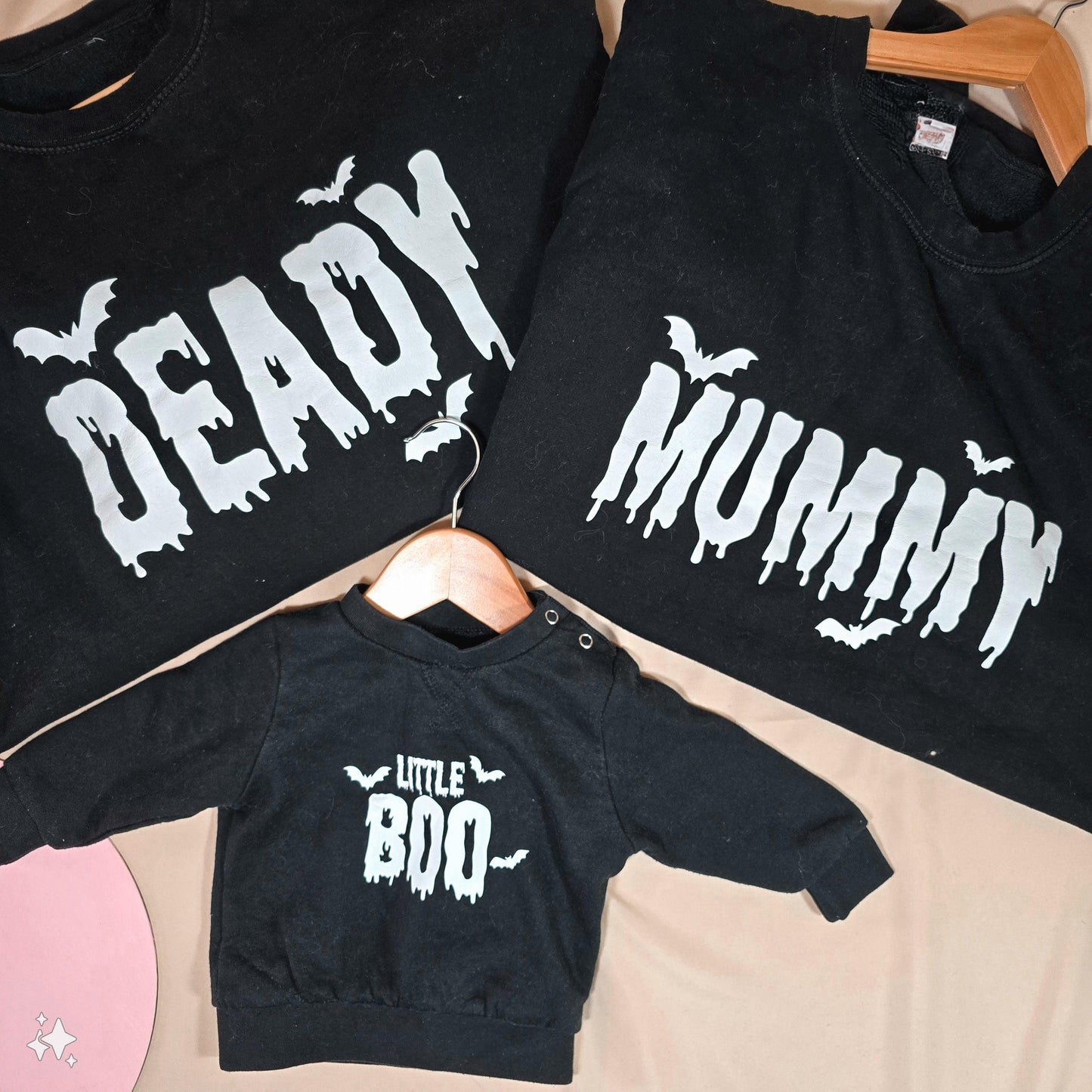 Set of three Halloween jumpers, featuring designs that say "Deady," "Mummy," and "Little Boo." Available in kids and unisex adult sizes.