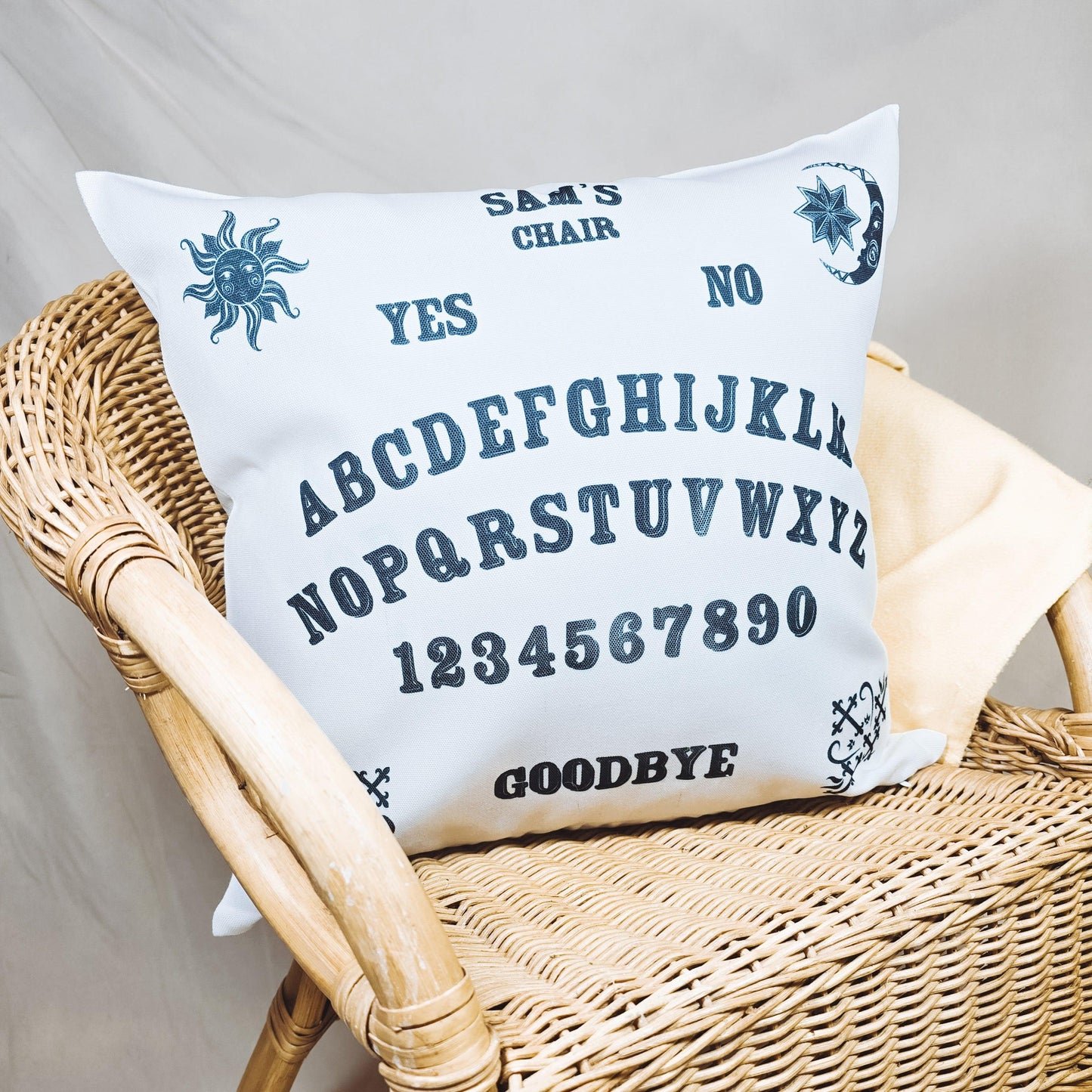 Personalized cushion with an intricate Ouija board design and the text "Name's Chair," featuring a spooky Halloween theme.
