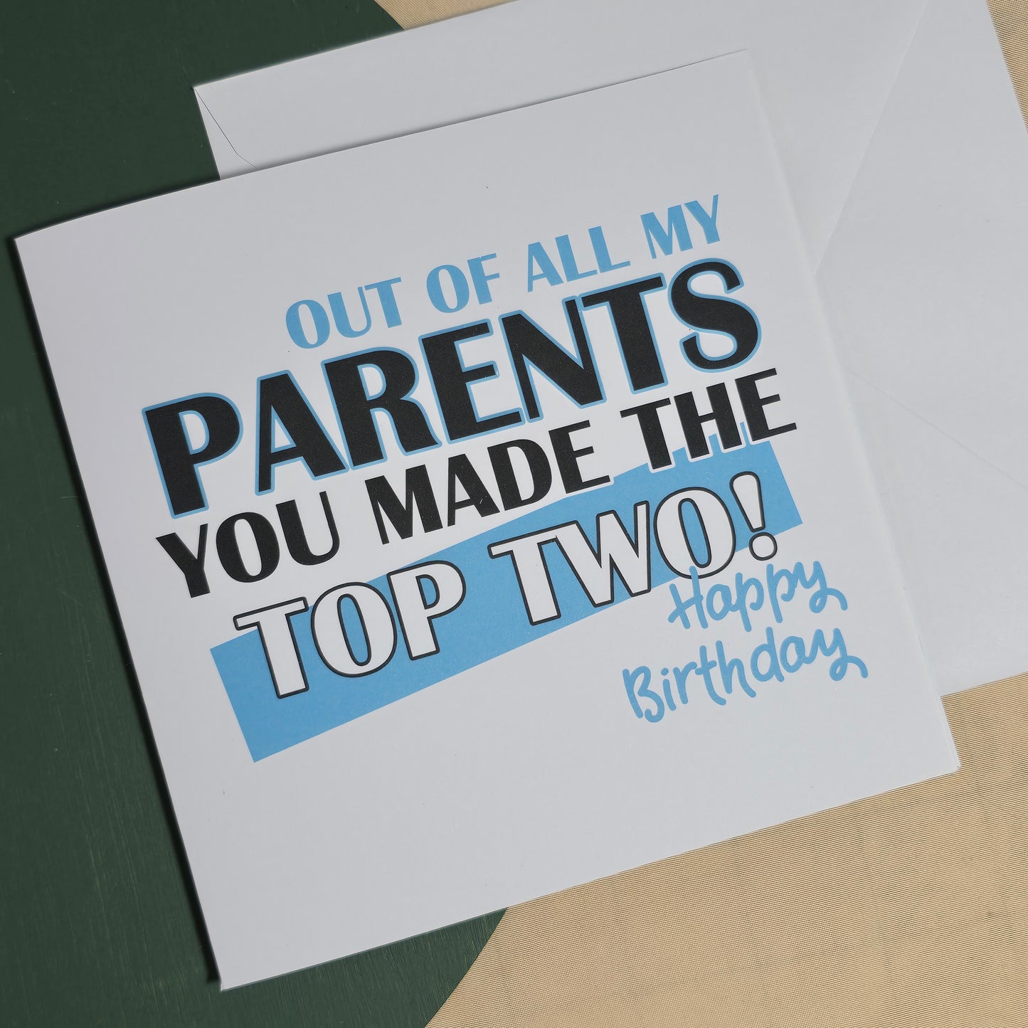 Birthday card with humorous text on a plain background