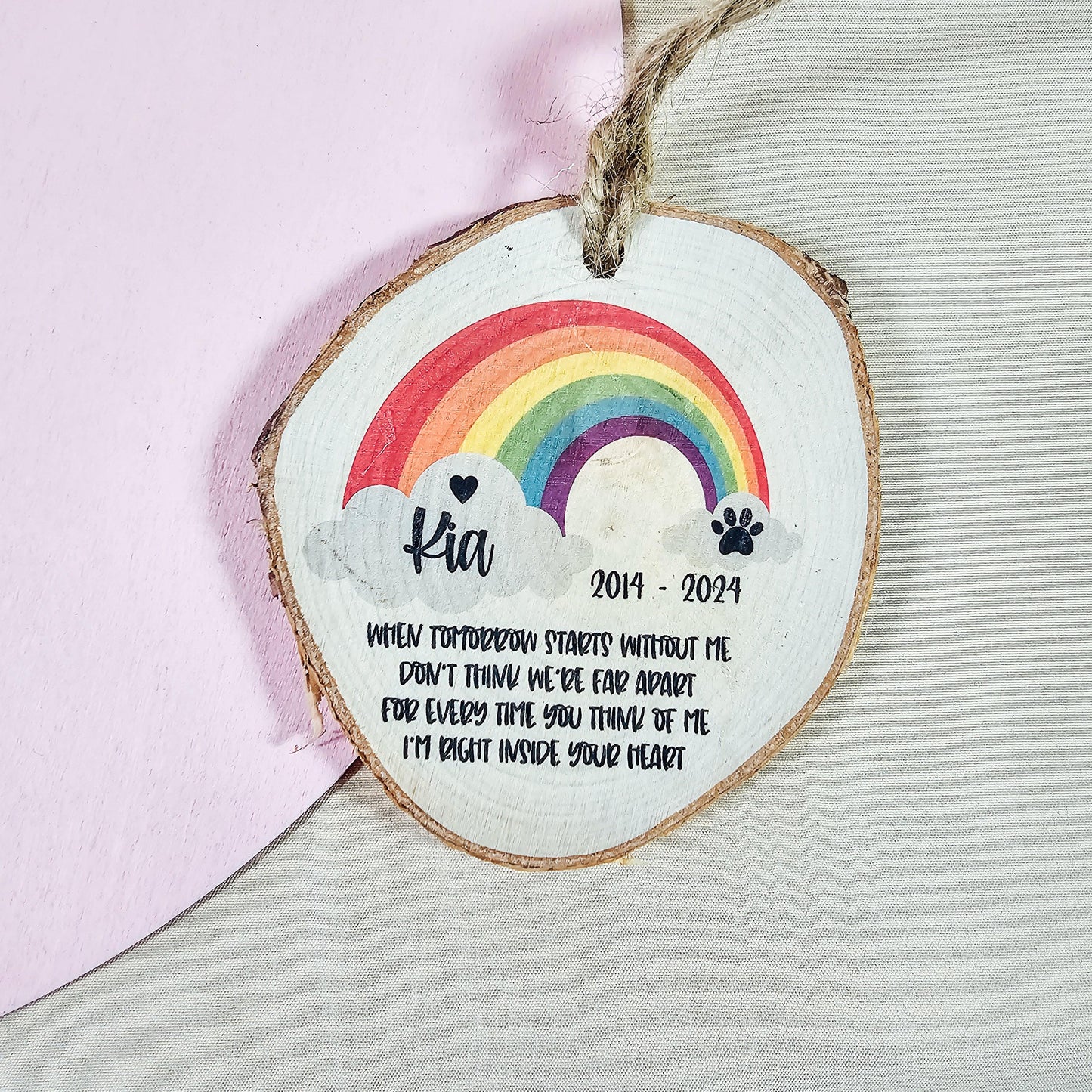 Natural wood log slice (8cm) featuring a rainbow for the Rainbow Bridge, personalised with a pet's name, life dates, and a poem to commemorate a beloved pet's memory.
