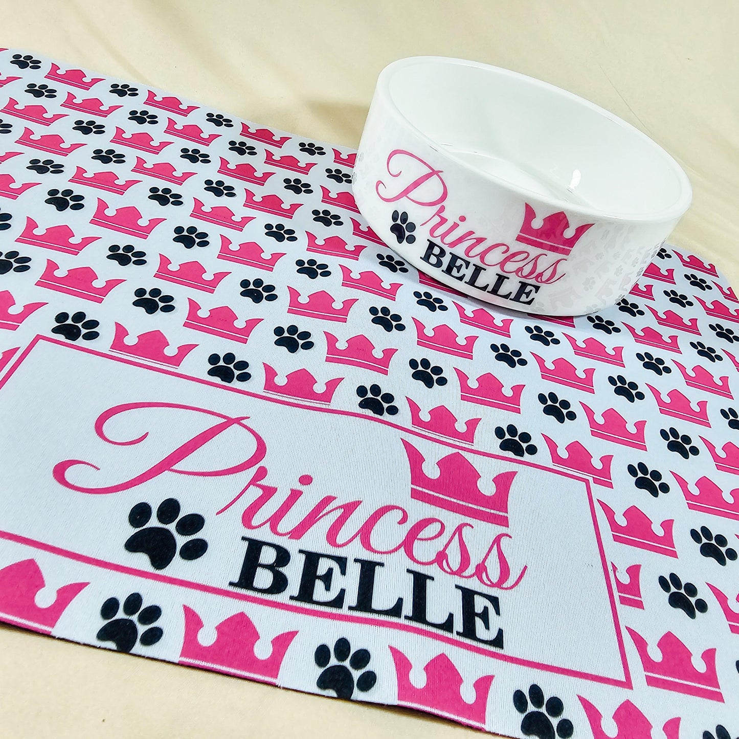 Personalised pet bowl with the text 'Princess Name' and a crown design. Available in small, medium, and large sizes, perfect for dogs or cats. Matching pet mats available.