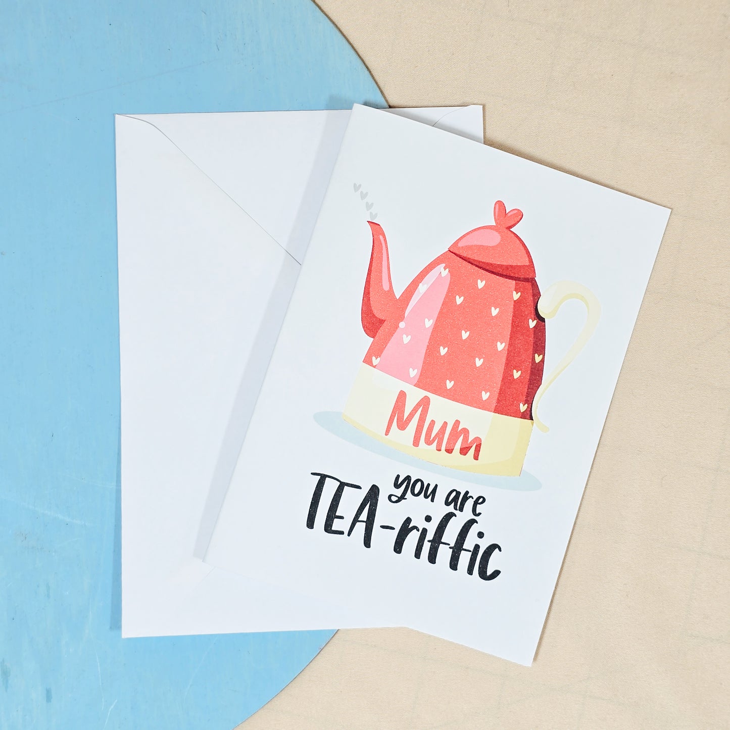 A6 Mother’s Day card with a teapot illustration and the phrase "Mum, You're Tea-riffic!", perfect for tea lovers, includes envelope.
