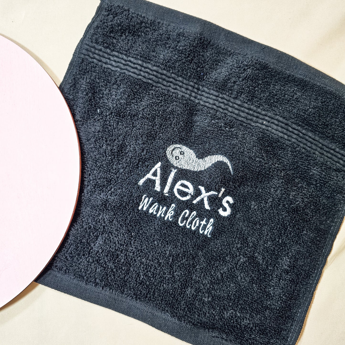 Personalised wank cloth with custom name, soft white towel with cheeky adult humour printed, perfect for a fun gag gift or novelty present.