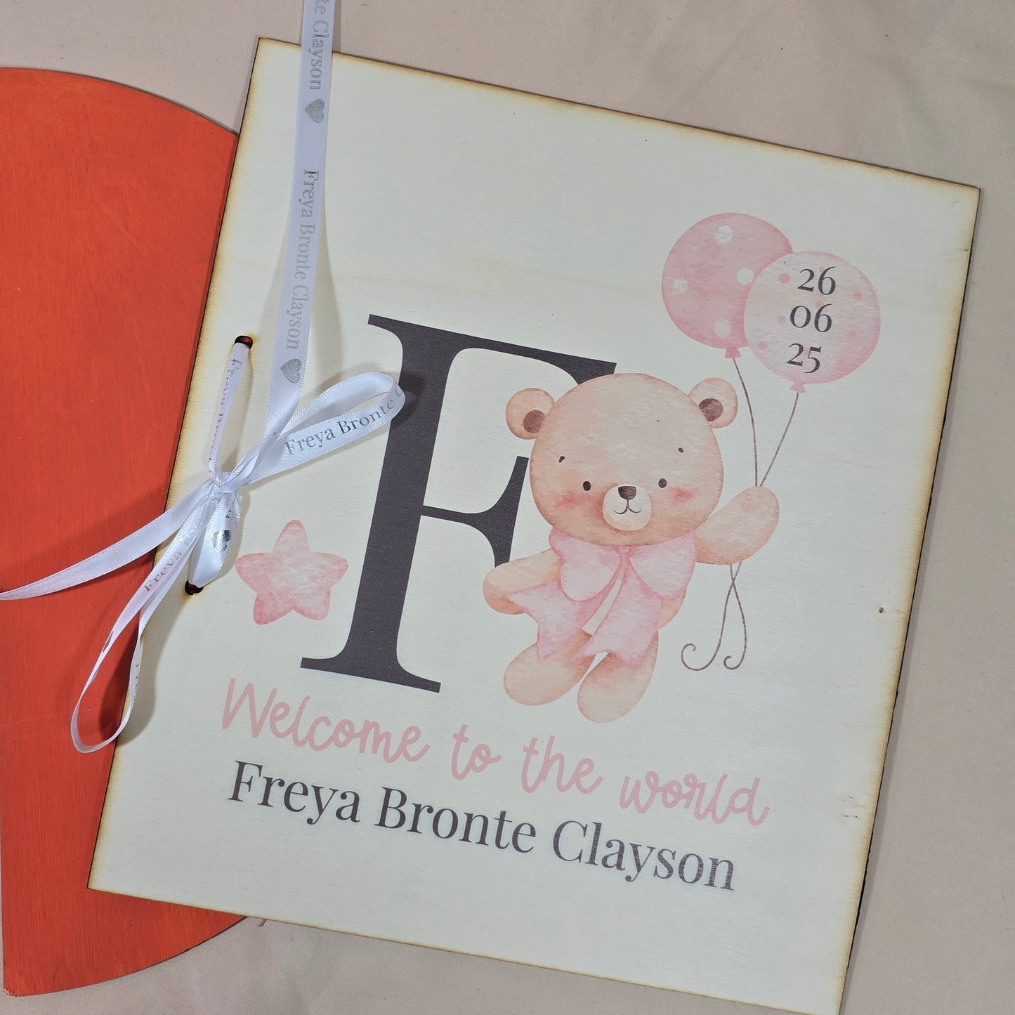 Baby shower card with teddy bear and balloons on a pink background