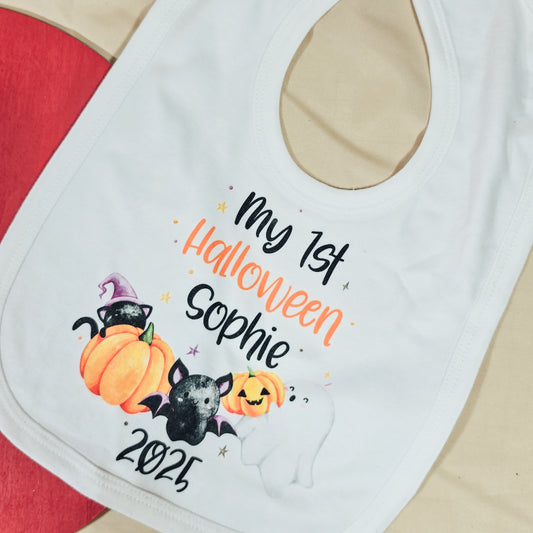 Personalised baby bib reading “My 1st Halloween [Name] [Year]” with cute pumpkin design, perfect for baby’s first spooky season.