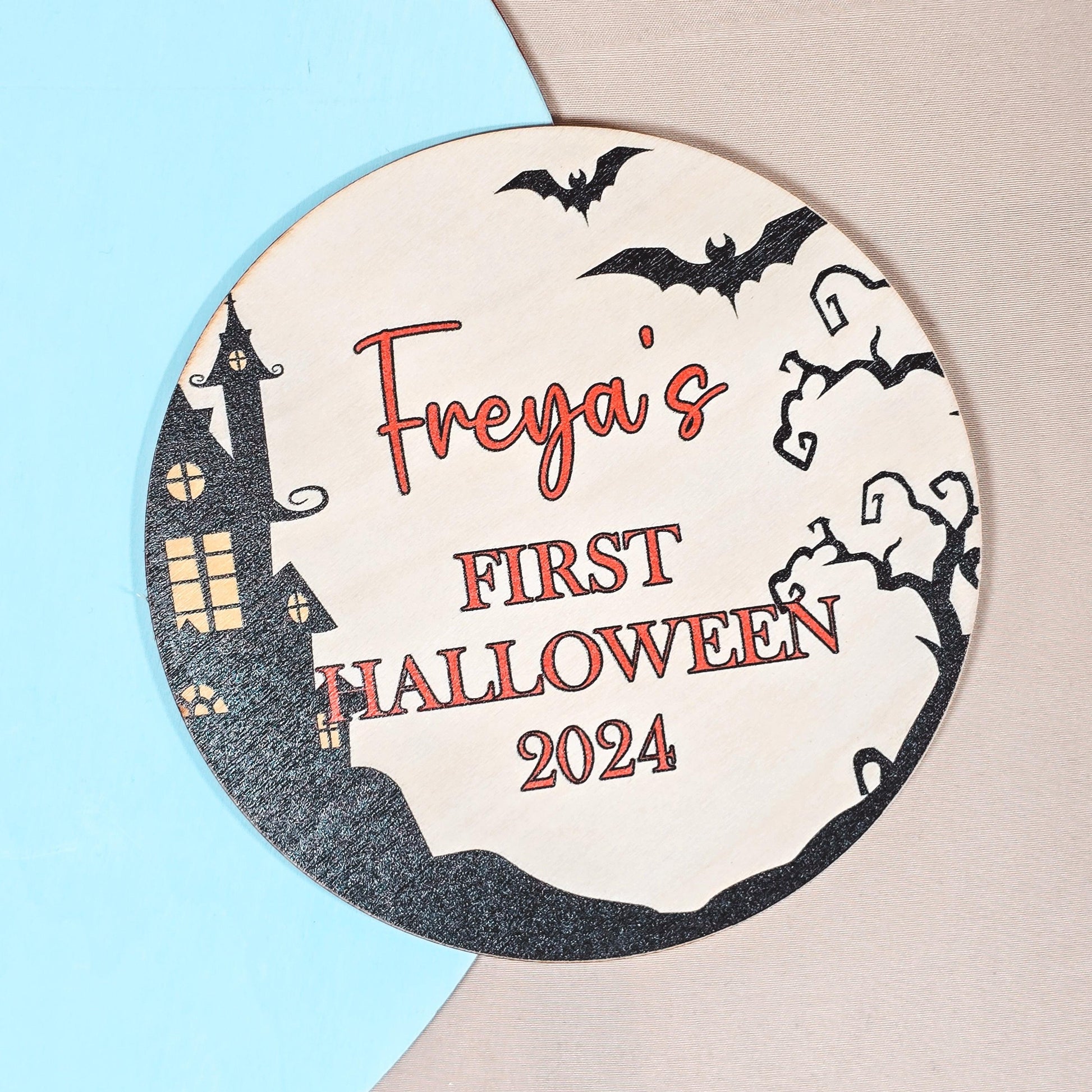 Personalised wooden sign for baby's first Halloween, featuring "Name's First Halloween [Year]" with a spooky design, perfect for nursery decor or Halloween celebration.