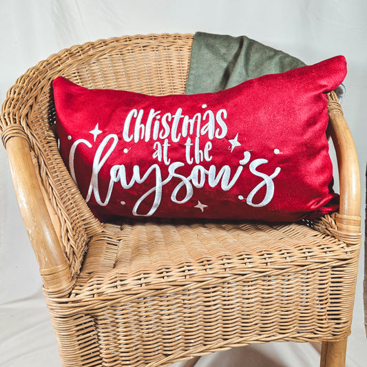 Red personalised Christmas cushion cover 50x30cm with “Christmas at the [Name]’s,” festive holiday home décor