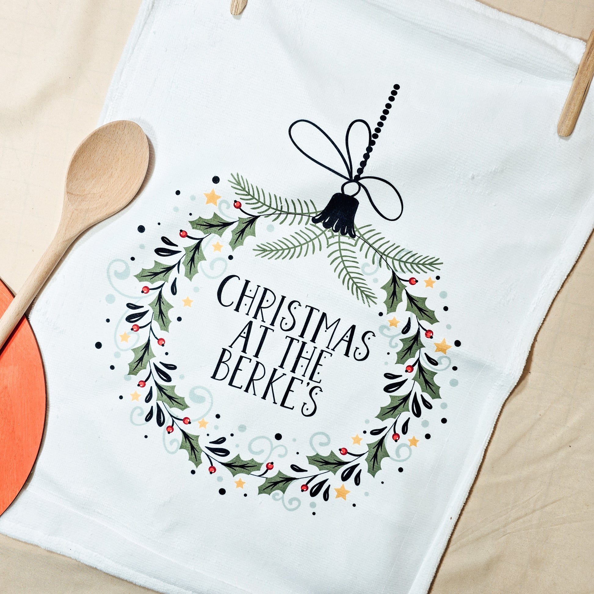 Personalised Christmas tea towel featuring the text "Christmas at the [name]".

