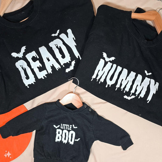 Set of three Halloween jumpers, featuring designs that say "Deady," "Mummy," and "Little Boo." Available in kids and unisex adult sizes.