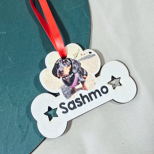 Personalized dog tag with a photo of a dog and the name 'name' on a textured surface.