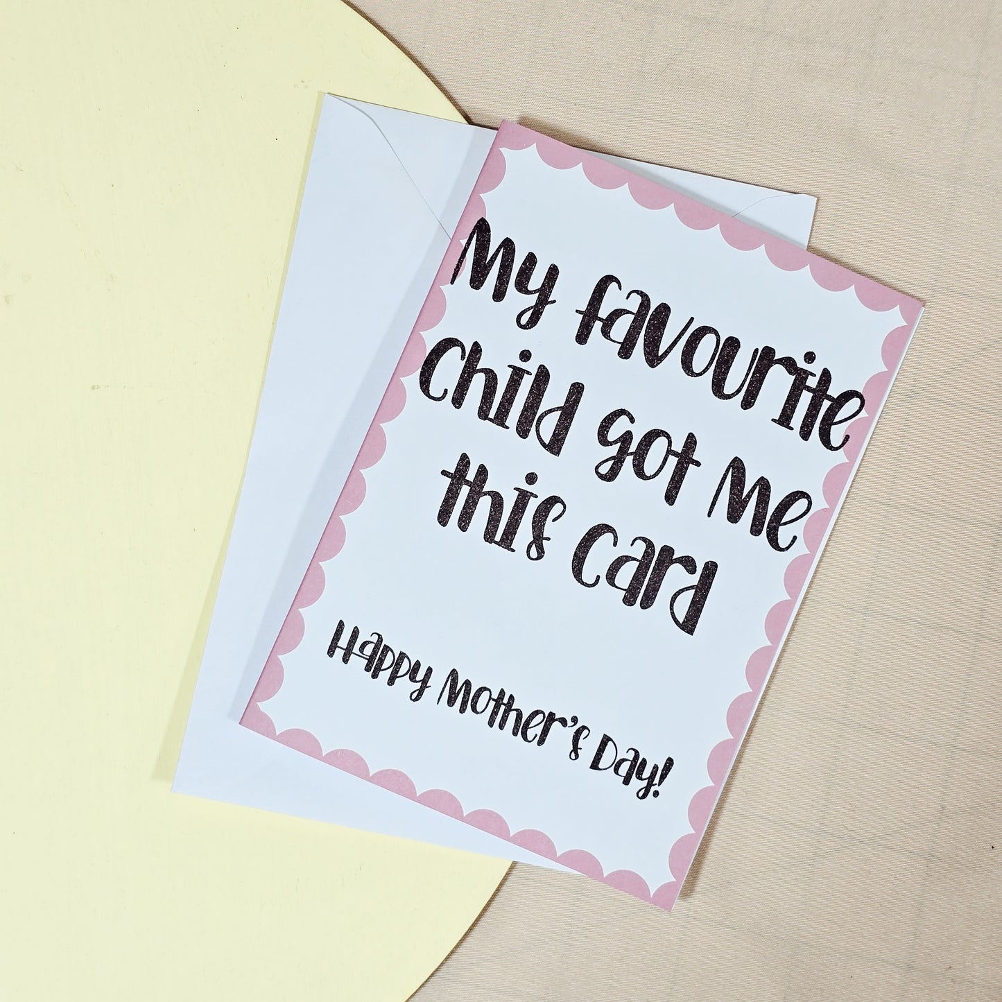 A6 Mother’s Day card with the text “My Favourite Child Got Me This Card. Happy Mother’s Day” in a playful font. Comes with a white envelope.







