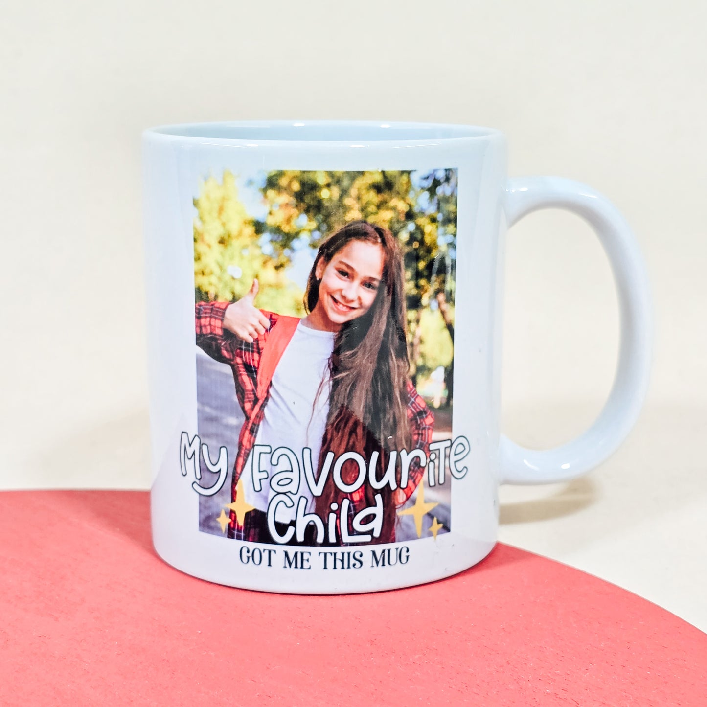 White ceramic photo mug with custom image and the text "My favourite child got me this mug."

