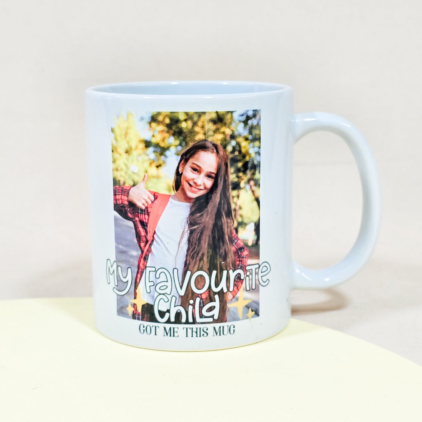 White ceramic photo mug with custom image and the text "My favourite child got me this mug."

