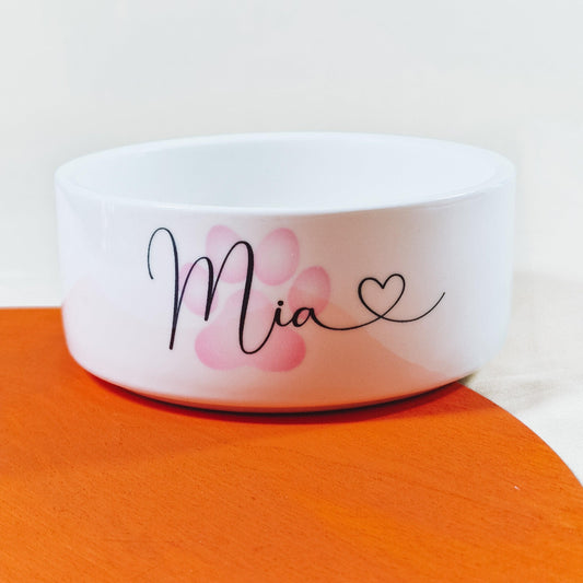 Personalised pet bowl featuring a paw print design with the dog's name and a heart at the end. Available in small, medium, and large sizes, perfect for adding a touch of love to your pet’s feeding time.