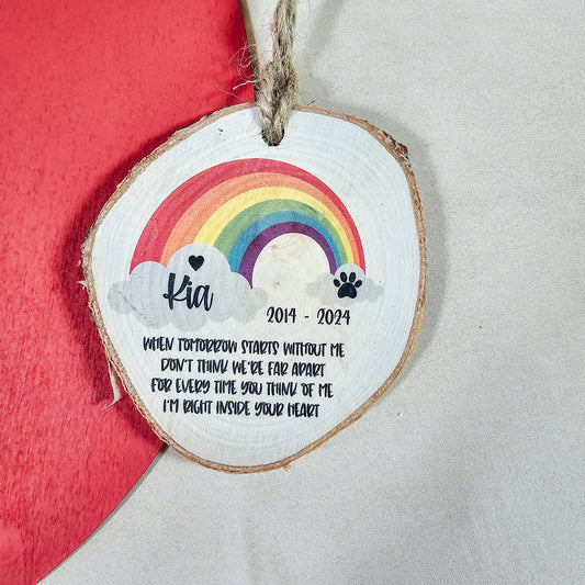 Natural wood log slice (8cm) featuring a rainbow for the Rainbow Bridge, personalised with a pet's name, life dates, and a poem to commemorate a beloved pet's memory.