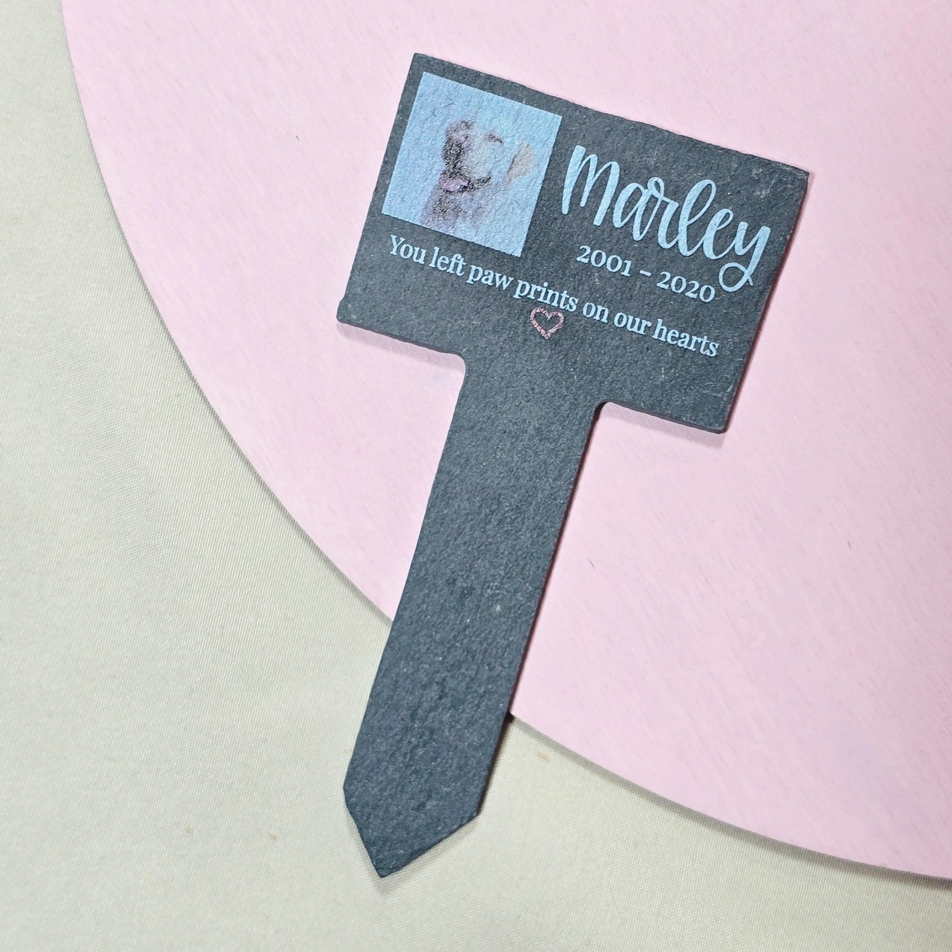 Personalised slate pet memorial stake with a custom pet photo, name, and message, used as a grave or plant marker in memory of a beloved pet.