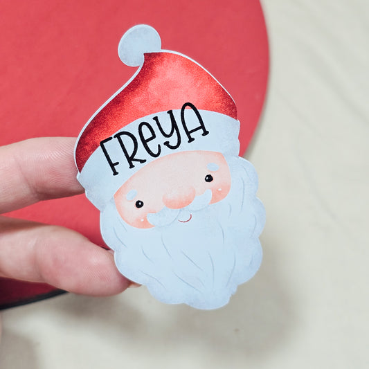 Pack of 25 personalized Santa-shaped Christmas stickers with custom names, 7x4cm, perfect for holiday gift wrapping