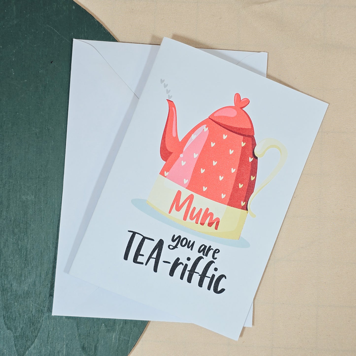 A6 Mother’s Day card with a teapot illustration and the phrase "Mum, You're Tea-riffic!", perfect for tea lovers, includes envelope.



