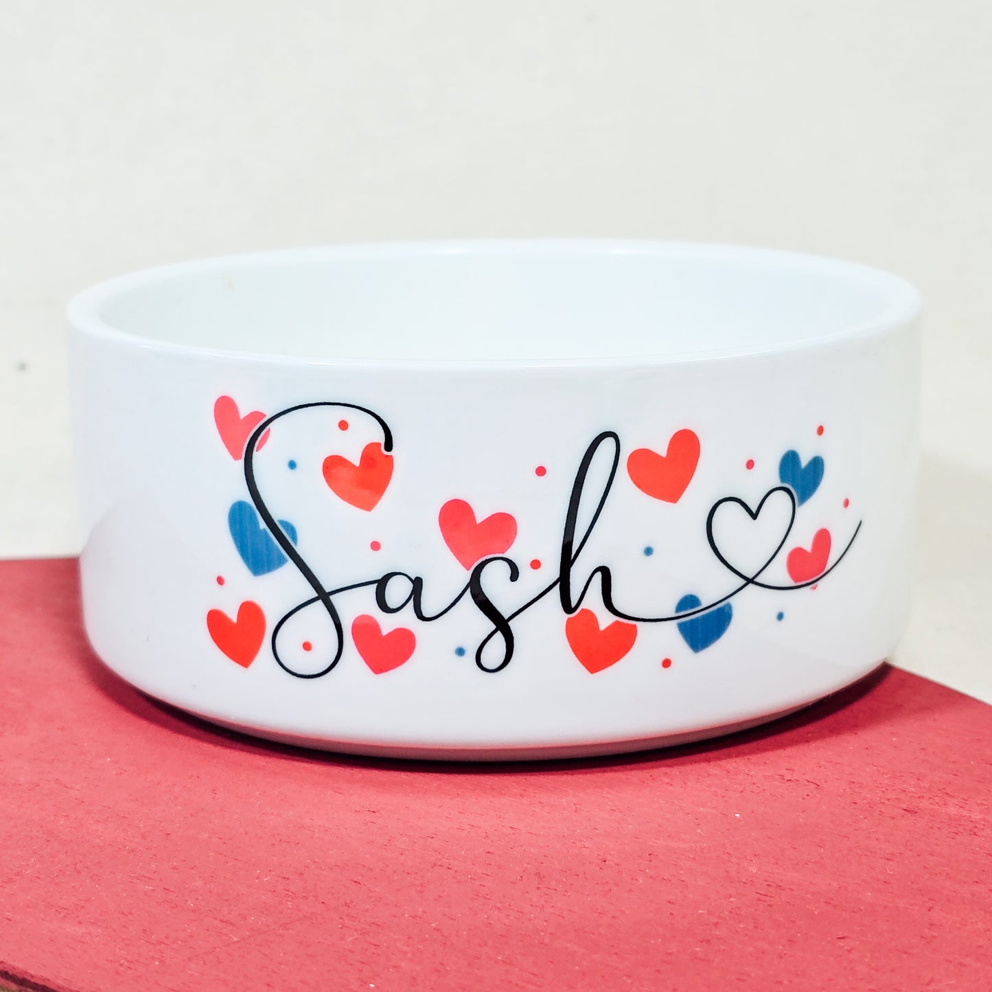 Personalised pet bowl with script font and love hearts, perfect for Valentine's Day.