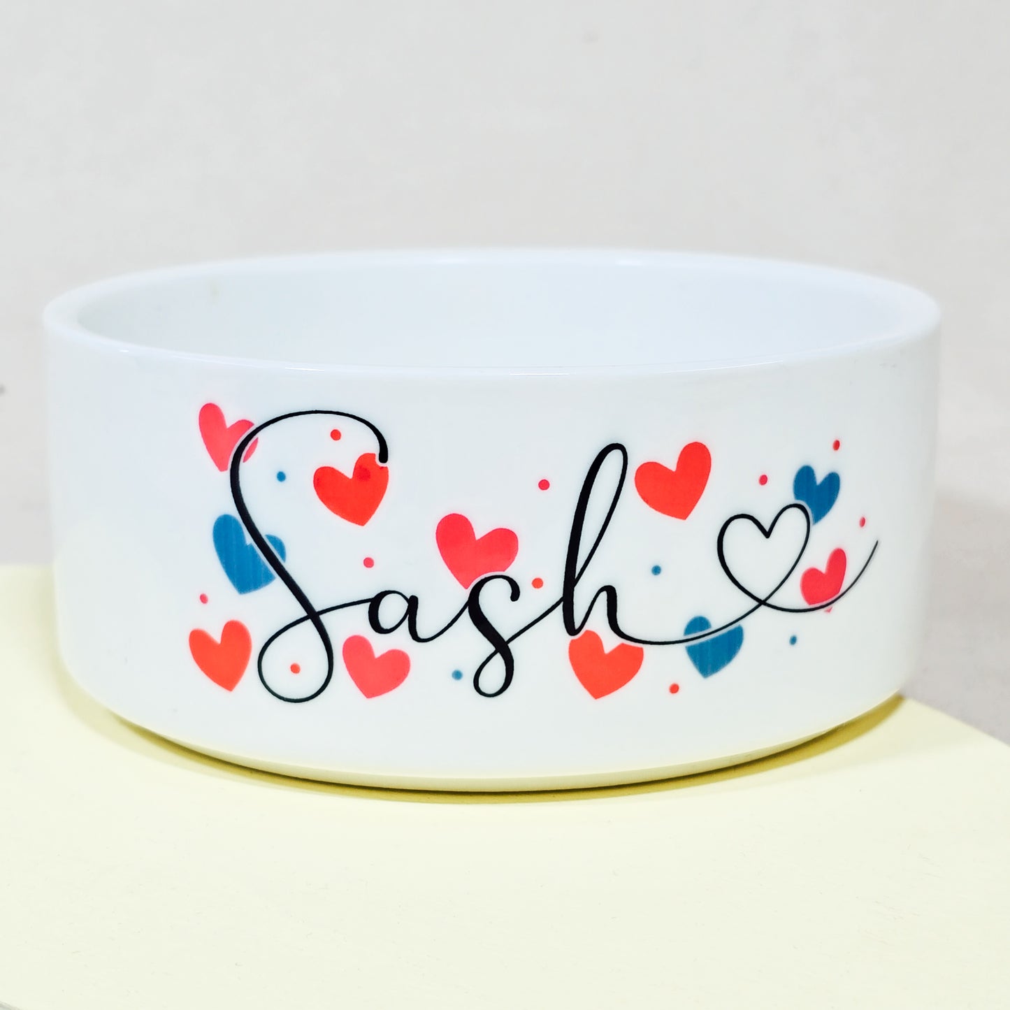 Personalised pet bowl with script font and love hearts, perfect for Valentine's Day.