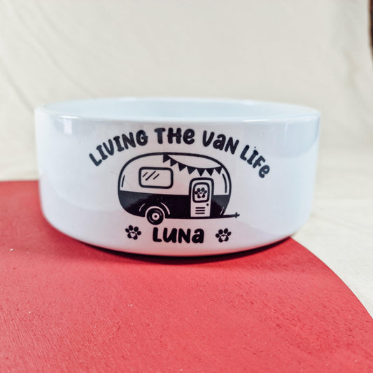 Personalised pet bowl featuring a caravan design and the text 'Living the Van Life.' Perfect for travel-loving pets, available in small, medium, and large sizes.