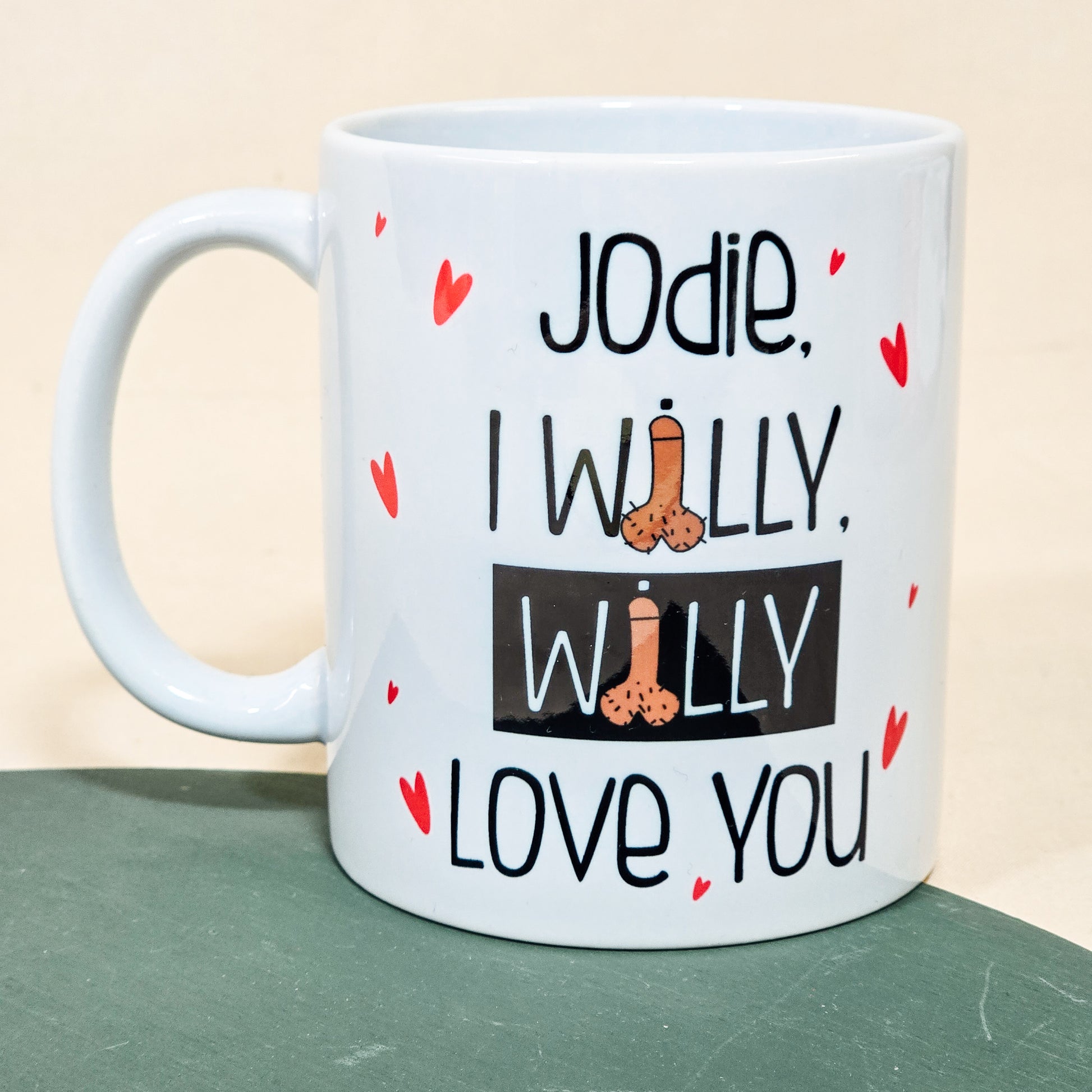 A white ceramic mug with the playful phrase "[Name], I Willy Willy Love You," perfect as a funny personalised Valentine's or anniversary gift.

