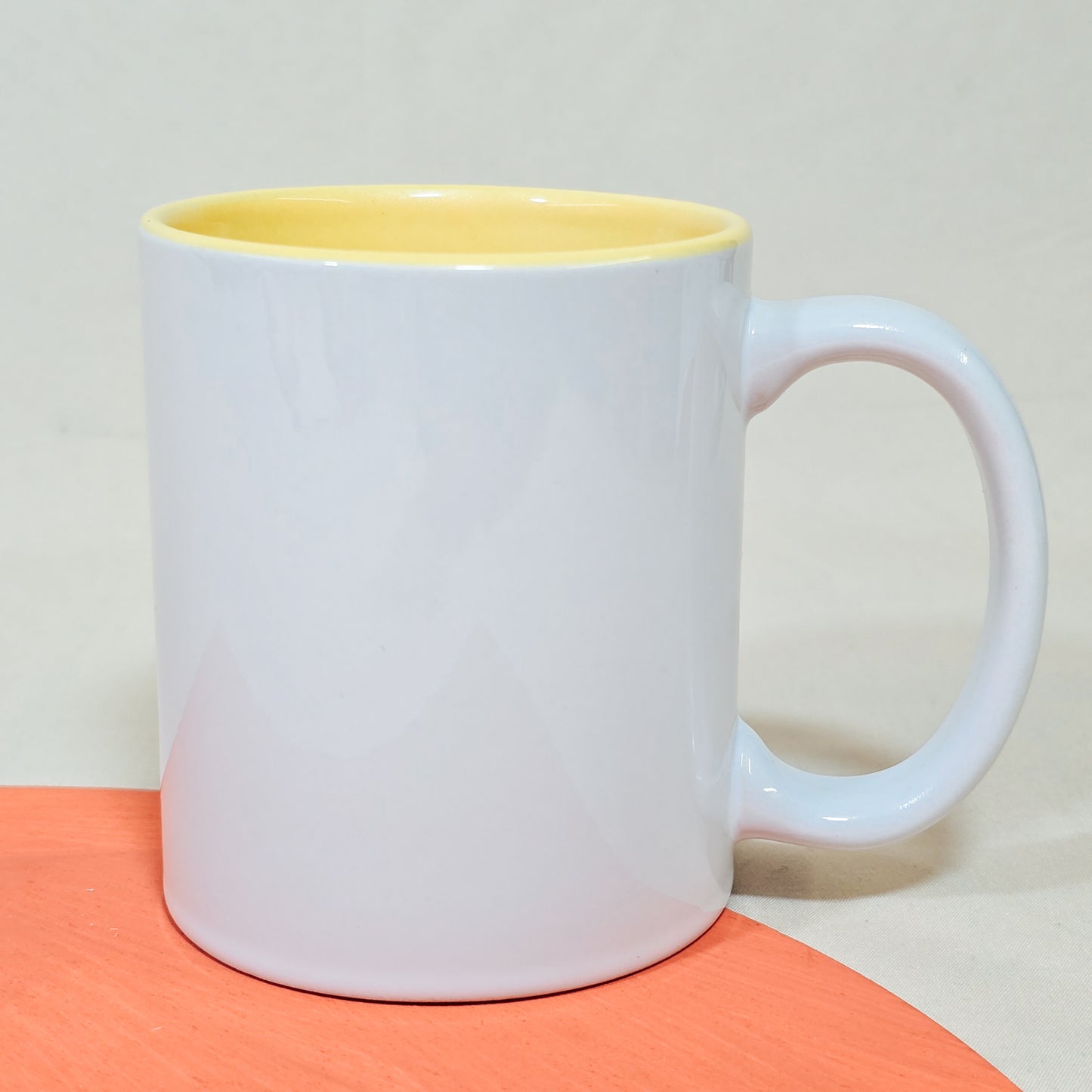 A customisable 10oz ceramic mug with a yellow inner, showcasing a photo, logo, or personalised text for a unique gift or keepsake.






